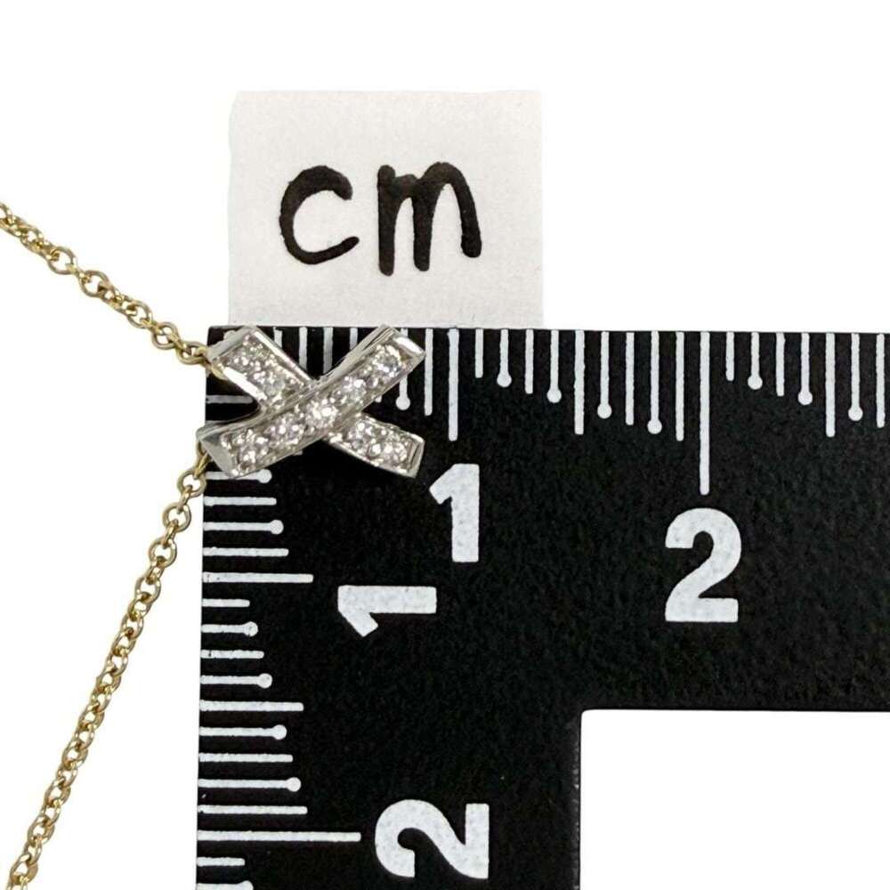 Tiffany & Co. Kiss pendant necklace, 18K gold, platinum, diamonds. - Picture 8 of 10